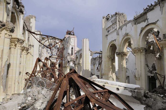 shutterstock_60670489.jpg Interior view of a destroyed building with collapsed arches and debris