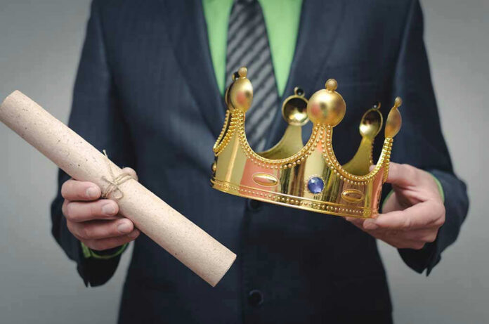 Person holding a crown and a scroll