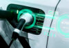HORRIFYING EV Danger Nobody Talks About Electric car charging with futuristic display interface.