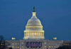 U.S. Capitol building illuminated at dusk.