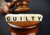 Milwaukee Judge CONVICTED — UNHEARD of RULING A gavel striking down next to wooden blocks spelling 'GUILTY'