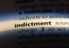 Close-up of a dictionary page showing the definition of 'indictment'