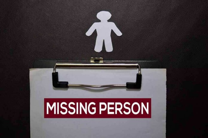 Clipboard with a missing person notice and a paper cutout figure