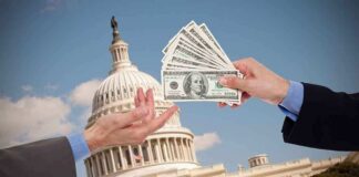 Hands exchanging cash in front of the Capitol building