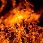 Worker TORCHES Warehouse–ASOUNDING VIDEO Close-up of vibrant flames against a dark background