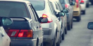 A line of cars stuck in traffic on a roadway