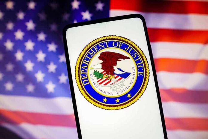 Department of Justice emblem displayed on a smartphone with an American flag background