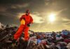 EPA STRIPS Climate Rule—$1.3 Trillion Earthquake Person in protective gear standing on a landfill with a yellow container