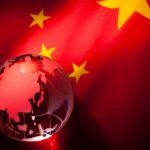 China-Iran Missile Pipeline Alarms Pentagon A globe illuminated against the backdrop of the Chinese flag