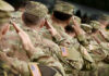 European Elites DECLARE Trump An ENEMY! Soldiers in camouflage uniforms saluting in formation outdoors