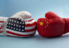 Moon Wars Brewing — Is CHINA EYEING The Moon? USA and China boxing gloves facing each other.