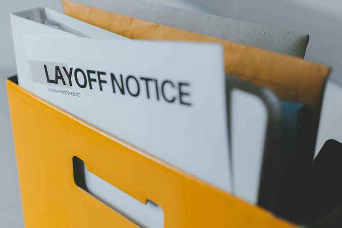 172298839 Layoff notice in a yellow box.