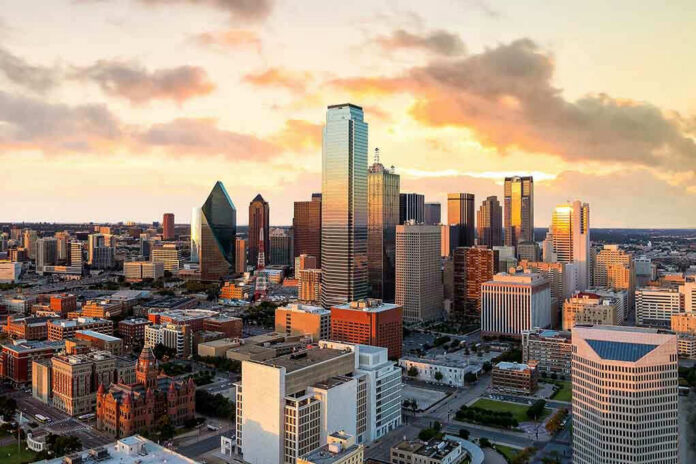 478361992 City skyline at sunset with modern skyscrapers.