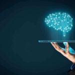 Silicon Valley’s Radical BRAIN IMPANT Push Hand holding tablet projecting digital brain hologram.