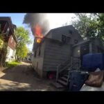 BODY CAM VIDEO: Officer catches baby dropped from window of burning home in Kalamazoo