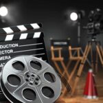 Film production equipment including a clapperboard, film reel, and directors chair