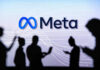 Meta Muzzles Whistleblower—Onstage People silhouetted against Meta logo background.