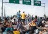 People sitting and resting on a highway.