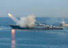 49 Missiles Launched — Chaos Or Control? Warship firing missile in the sea.