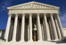 Court to Trump: You Can’t Cancel Asylum — Only Congress Can Facade of the Supreme Court building featuring tall columns and intricate carvings