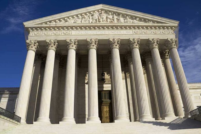 Facade of the Supreme Court building featuring tall columns and intricate carvings