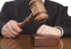 The Case That Could Restore 12-Person Juries A judge holding a gavel above a wooden block