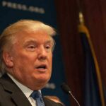 Capitol Meltdown: Trump Rewrites Intel Rules A public figure speaking at a podium during a press conference