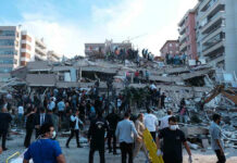 Panic Rises, Body Count Still Missing People at a collapsed building after an earthquake.