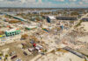Aerial view of hurricane-damaged buildings and debris.