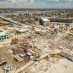 Body Count Chaos Grips Venezuela Aerial view of hurricane-damaged buildings and debris.