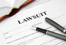 A Woman Goes on Record — Platner Says It Never Happened Legal document titled Lawsuit with pen and book.