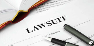 Legal document titled Lawsuit with pen and book.