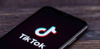 smartphone displaying the TikTok app logo on screen