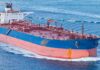 Large cargo ship navigating through the ocean