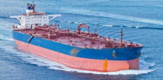 Large cargo ship navigating through the ocean