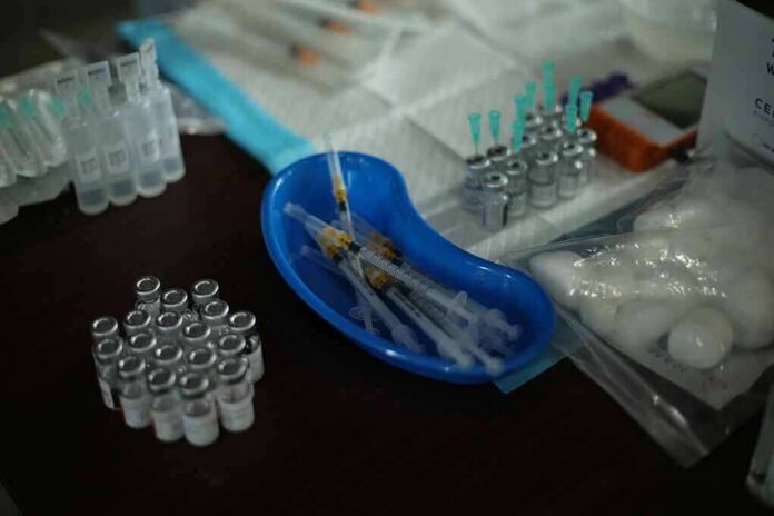 Medical syringes and vials arranged on a table