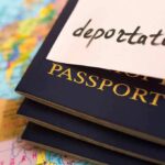Refusal Backfires—Next Stop, Equatorial Guinea Stack of passports with a note labeled deportation on top, placed on a map