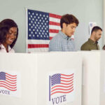 Voters casting ballots at polling booths