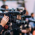 Spirit Airlines COLLAPSES: Trump’s Bold Rescue CRUSHED! Video cameras on tripods at a media event
