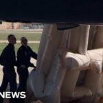 Crews Check Air Force One Before Takeoff Air Force One emergency slide mistakenly deployed