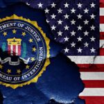 FBI seal and American flag on cracked wall