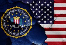 FBI seal and American flag on cracked wall