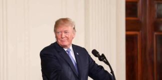 man at podium with presidential seal