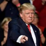 Trump Gives Iran Another Chance To Talk man in suit pointing toward the camera at an event