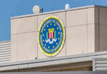 FBI emblem on a beige building facade