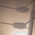 Boxing ring corner ropes in hazy light