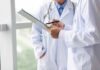 Doctors reviewing a clipboard