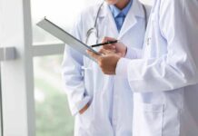 Doctors reviewing a clipboard