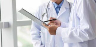 Doctors reviewing a clipboard