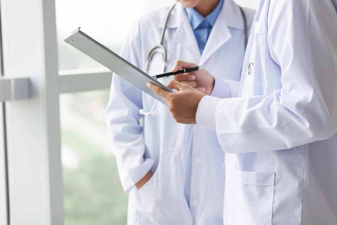 Doctors reviewing a clipboard